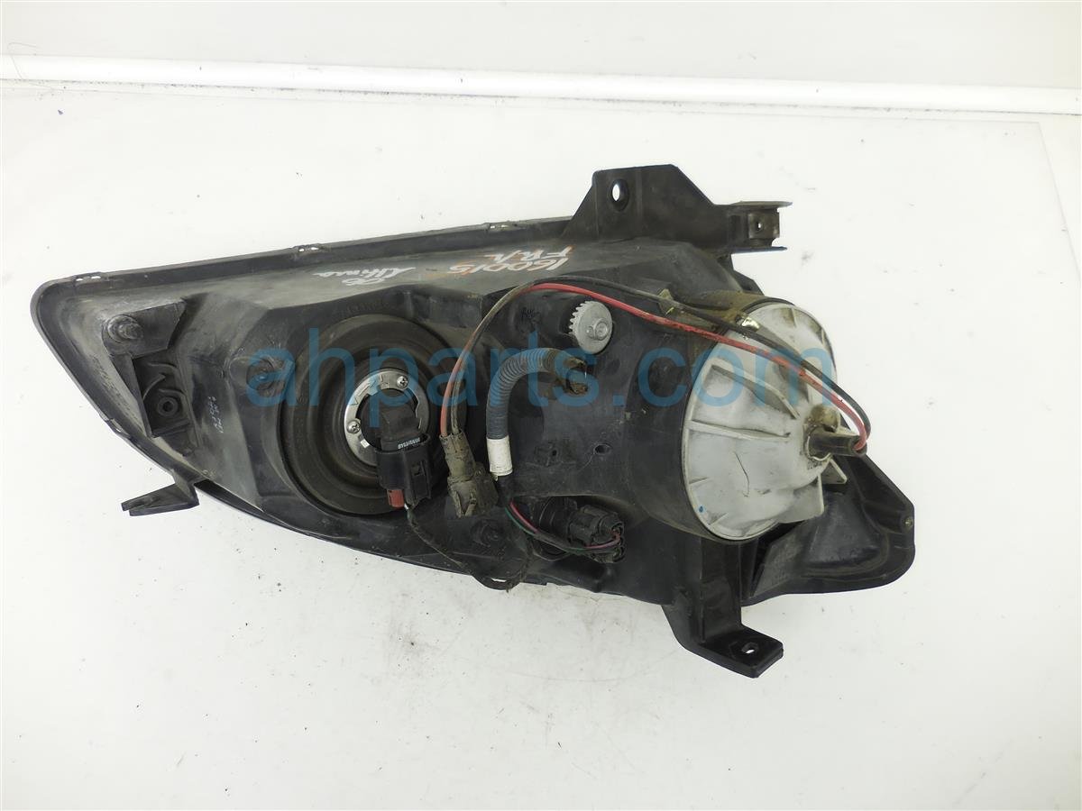 $40 Nissan LH Headlight- Halogen- NIQ