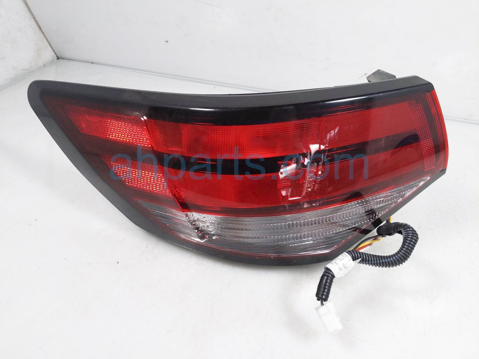 $165 Nissan LH TAIL LAMP (ON BODY)