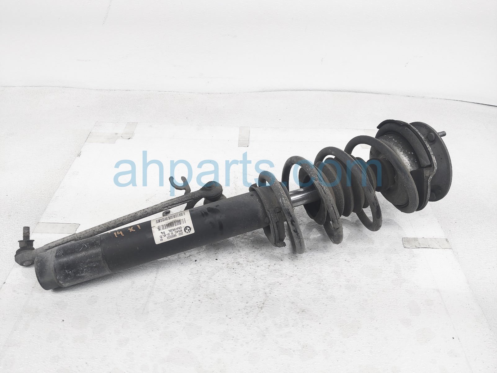 $85 BMW FR/LH STRUT + SPRING - W/O SPORT