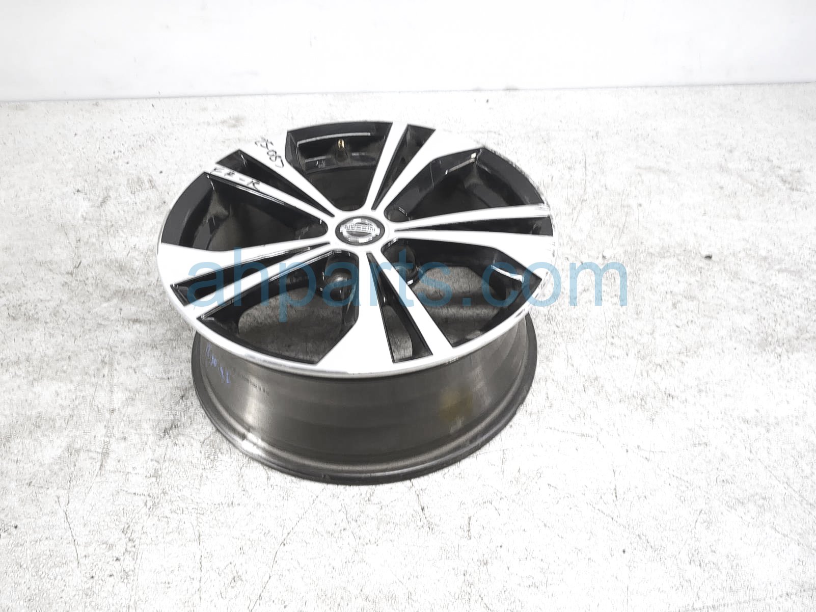 $119 Nissan FR/RH WHEEL / RIM - HAS CURB RASH