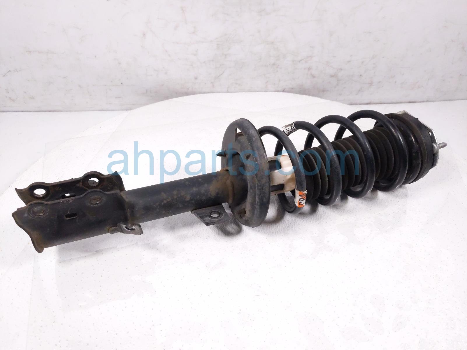 $100 Ford FR/LH STRUT + SPRING $100 Ford FR/LH STRUT + SPRING